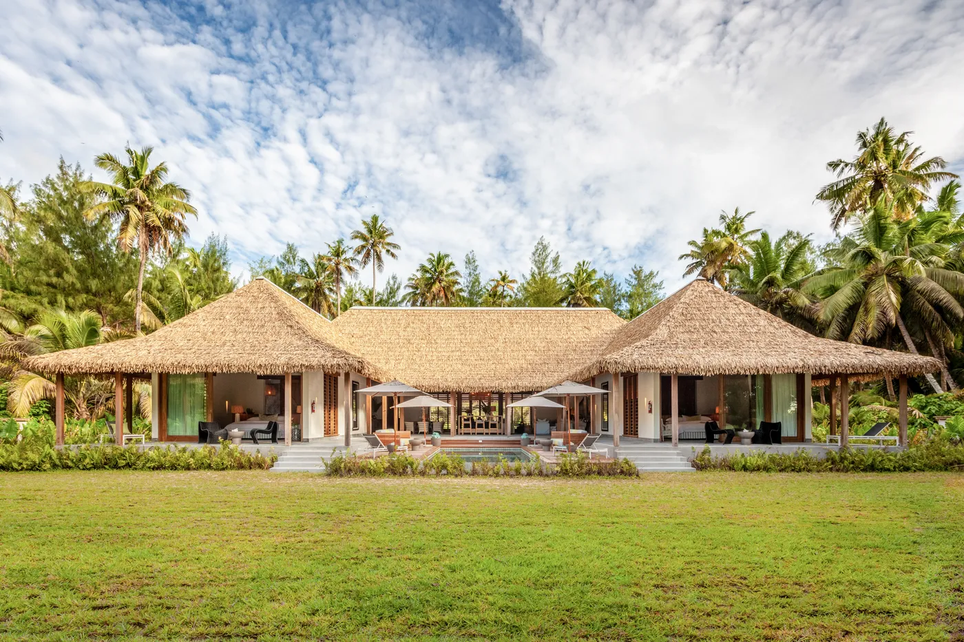 Four Bedroom Beach Retreat with palms and private garden