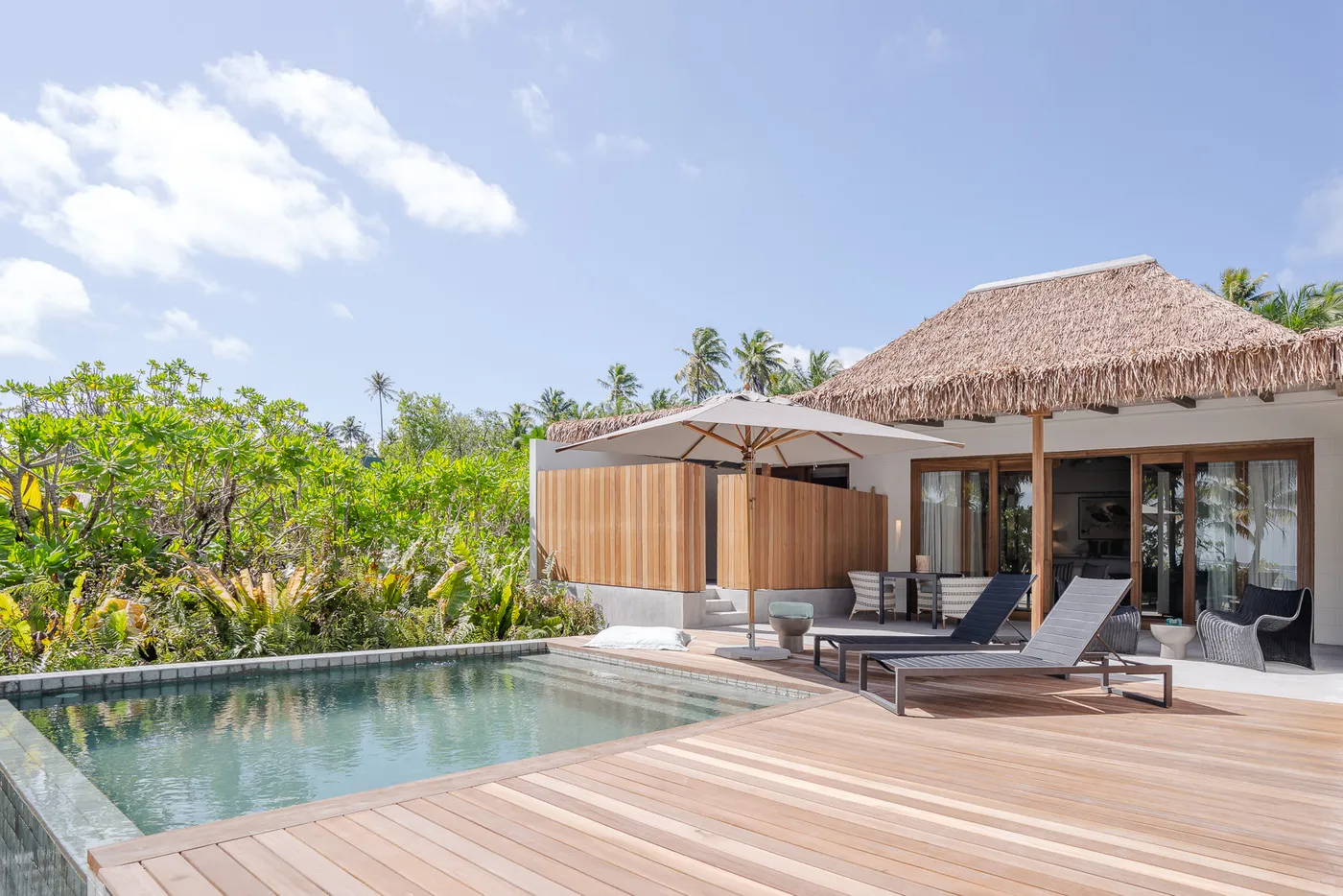 Beach Villa pool deck and thatched roof on Alphonse Island